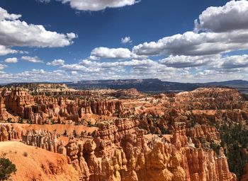 Panoramic view of landscape against cloudy sky