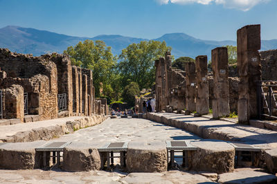 The streets of pompeii made of large blocks of black volcanic rocks