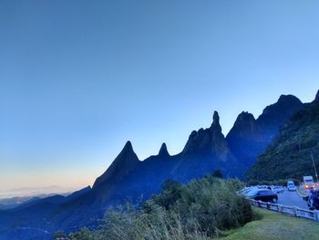 Panoramic view of mountains against clear blue sky