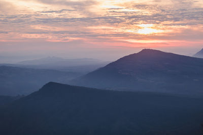 Scenic view of mountains against sky during sunset