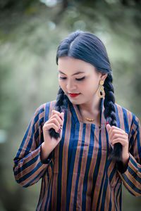 Portrait of young woman looking away