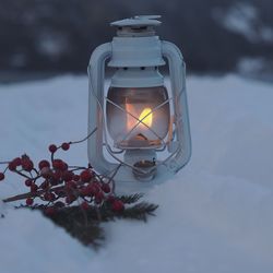 Close-up of illuminated christmas decorations on table