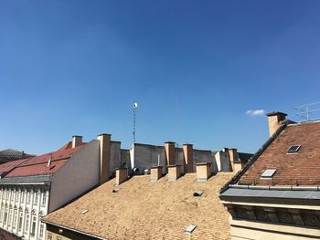 Low angle view of buildings against blue sky