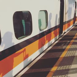 Train at railroad station platform against sky