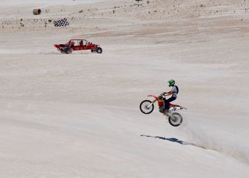 Full length of man cycling on motorcycle