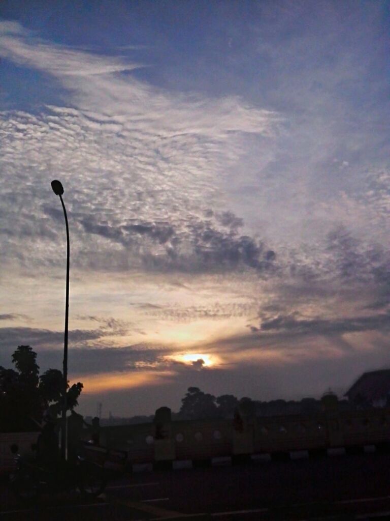 sunset, silhouette, sky, street light, cloud - sky, beauty in nature, scenics, tranquility, tranquil scene, nature, orange color, cloud, tree, landscape, idyllic, dusk, lighting equipment, cloudy, outdoors, dramatic sky