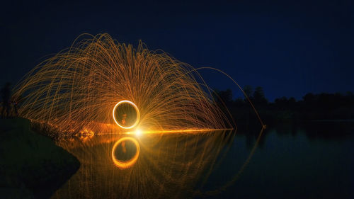 Light painting against sky at night