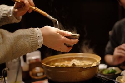 Midsection of woman working in tray