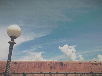 Low angle view of street light against sky