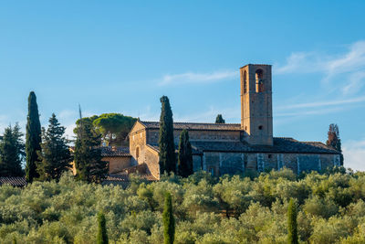 Skyline of monte oliveto abbey near little town of san gimignano, tuscany