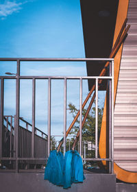 Bridge over balcony against blue sky