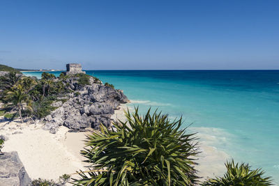 Scenic view of sea against clear blue sky