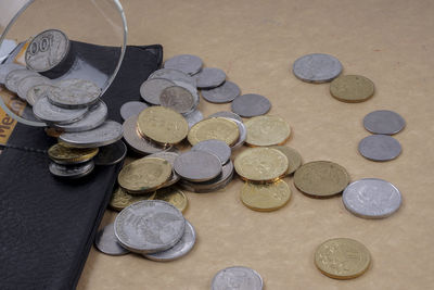 High angle view of coins on table