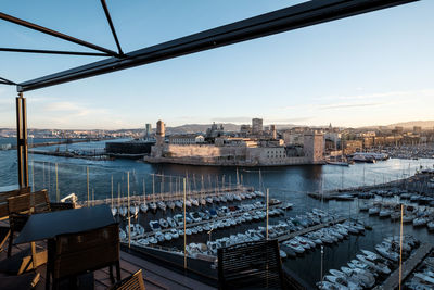 High angle view of boats moored at harbor