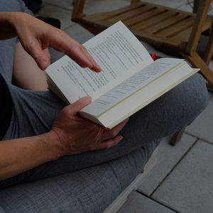 High angle view of man reading book