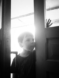 Portrait of boy looking away at home