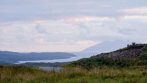 Sunset view of the isle of rum and loch eishort from the hills around heaste on the isle of skye