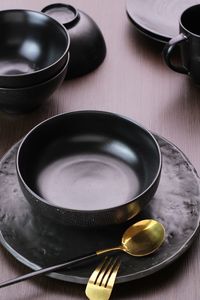 Close-up of eating utensils on table