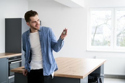 Side view of young businesswoman working at home