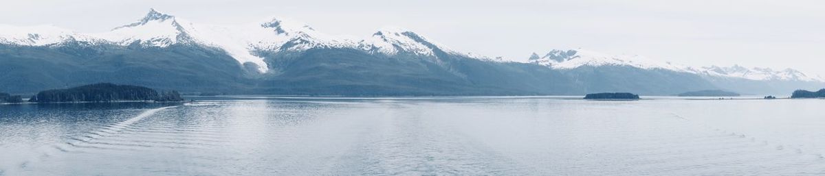 Scenic view of lake against sky during winter