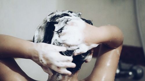 Woman shampooing her hair