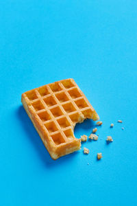 Close-up of ice cream over blue background