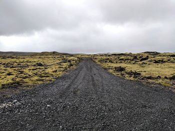 Road amidst landscape against sky