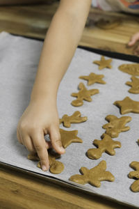 High angle view of child playing jigsaw puzzle