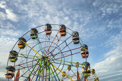 Low angle view of ferris wheel against sky