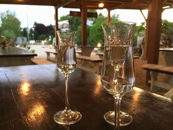 Close-up of wine glasses on table