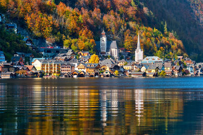 Buildings at waterfront during autumn