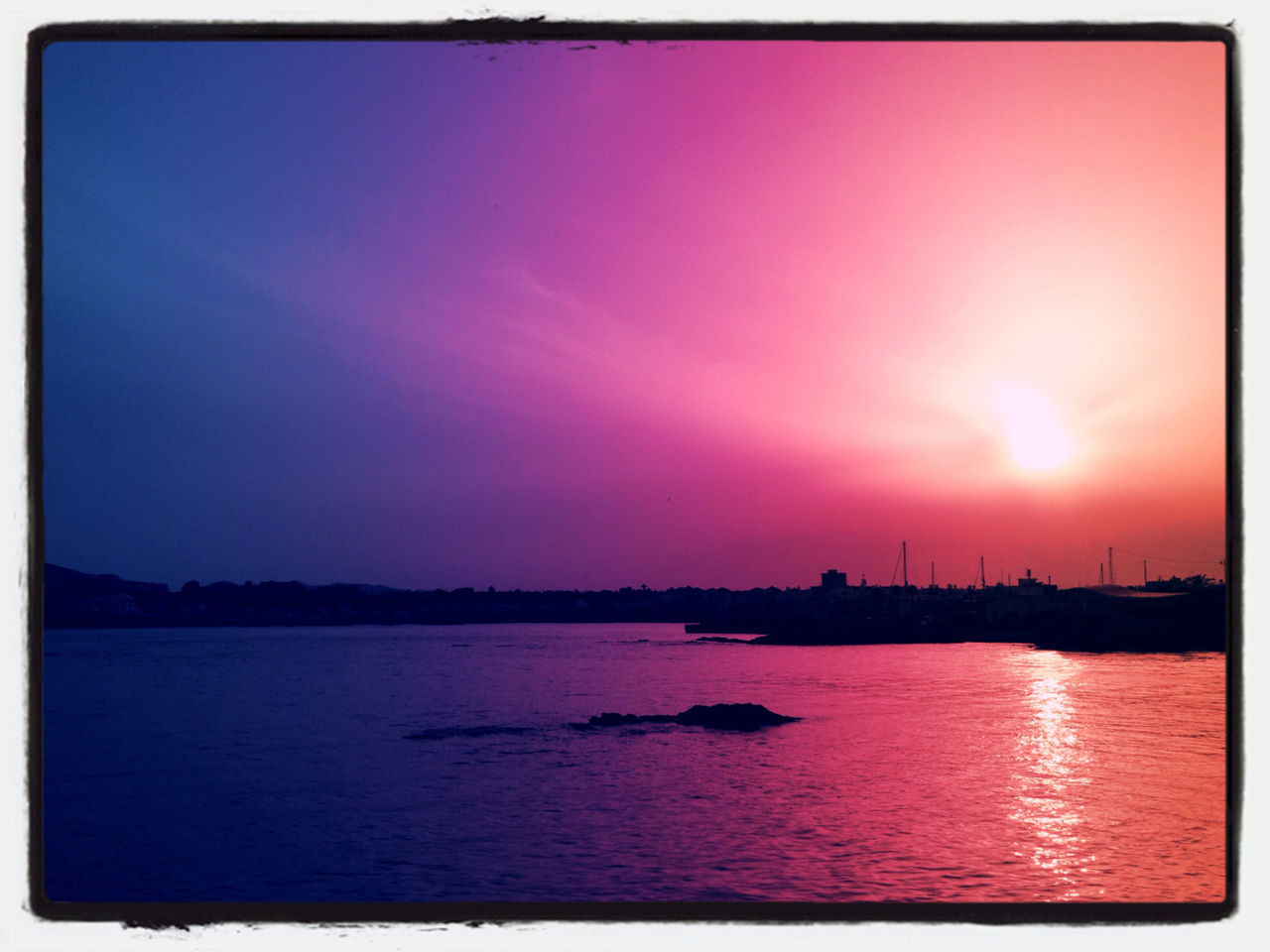 sunset, transfer print, water, auto post production filter, waterfront, sky, scenics, tranquil scene, tranquility, beauty in nature, sea, silhouette, nature, orange color, built structure, river, idyllic, reflection, nautical vessel, architecture