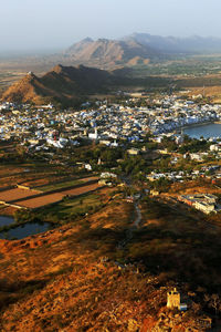 High angle view of residential district and mountains