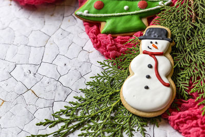 Directly above shot of gingerbread cookies on textured surface