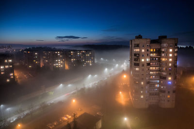 High angle view of illuminated buildings at night