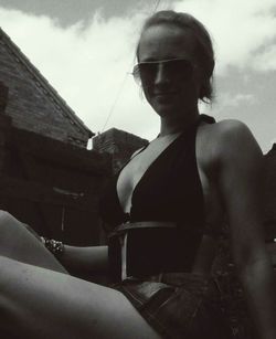 Close-up of woman standing against sky