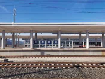 Train at railroad station against clear sky