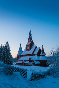 Traditional building against clear blue sky during winter