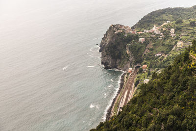 High angle view of sea and rocky mountains