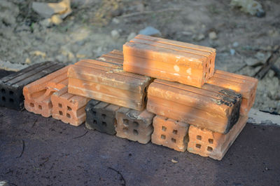 High angle view of stack of wood on field