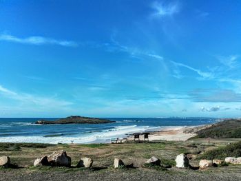 Scenic view of sea against blue sky