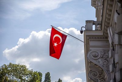 Big flag of turkey. turkish flag hanging on the building.