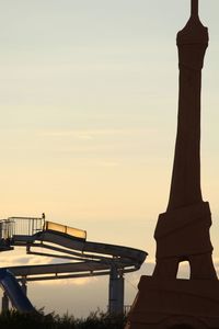 Low angle view of silhouette of building during sunset