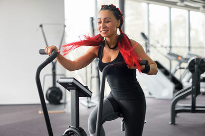 Full length of woman with bicycle