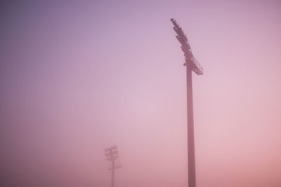 Low angle view of communications tower against sky