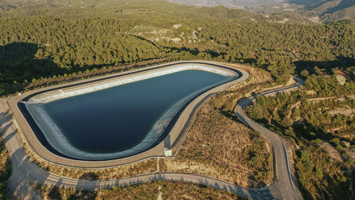 Aerial view of mountaintop reservoir at dusk