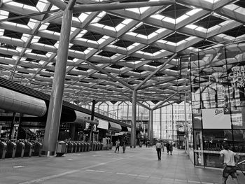 People walking on railroad station platform