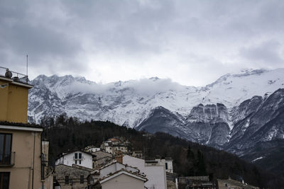 Scenic view of snowcapped mountains against sky
