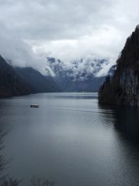 Scenic view of lake against cloudy sky