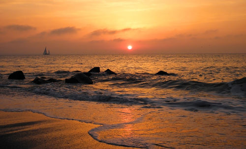 Scenic view of sea against sky during sunset